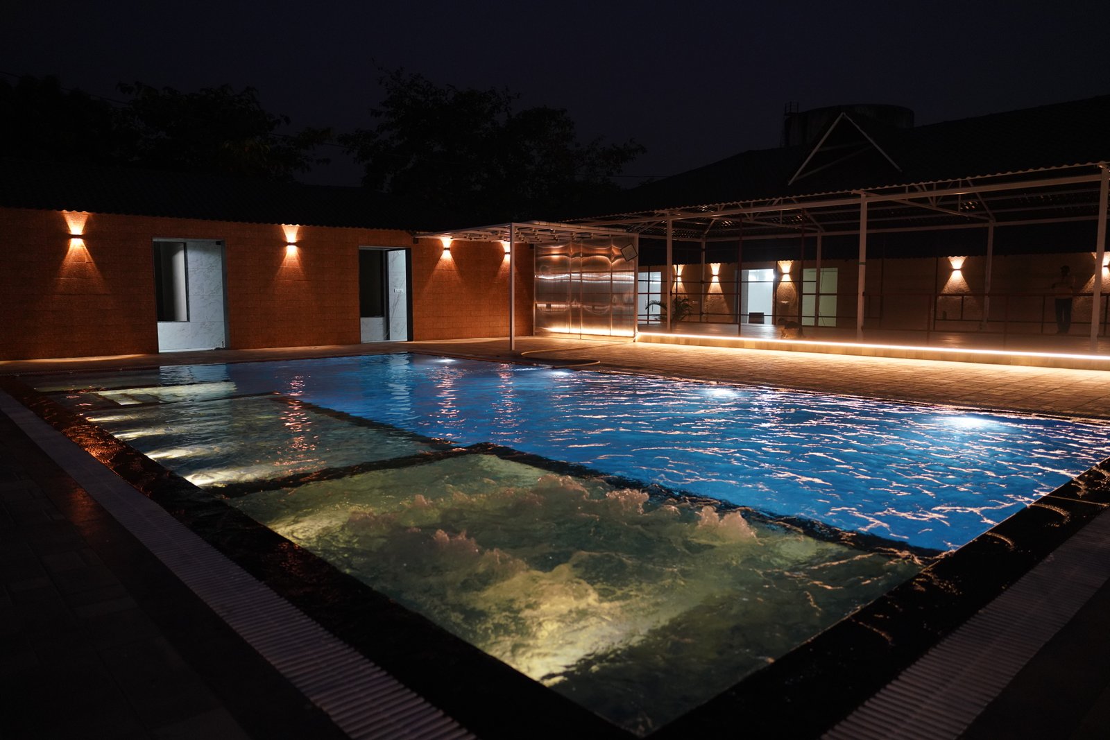 Relaxing poolside lounge area at Great Escape Club luxury resort